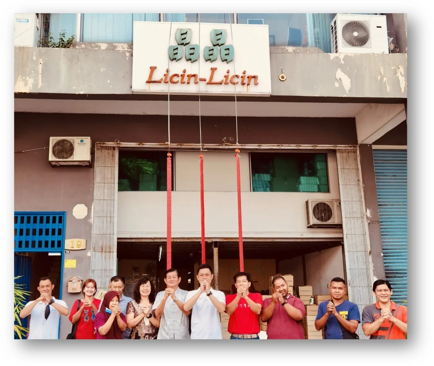 The Licin-Licin team gathered outside the original company premises